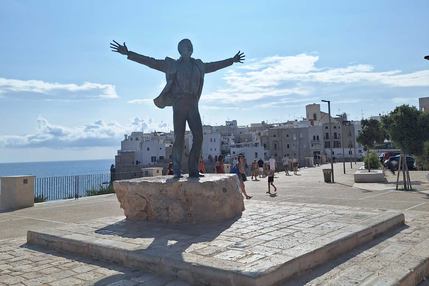 During the Sanremo week we take you to Polignano, the city of Domenico Modugno (and his splendid statue overlooking the sea)