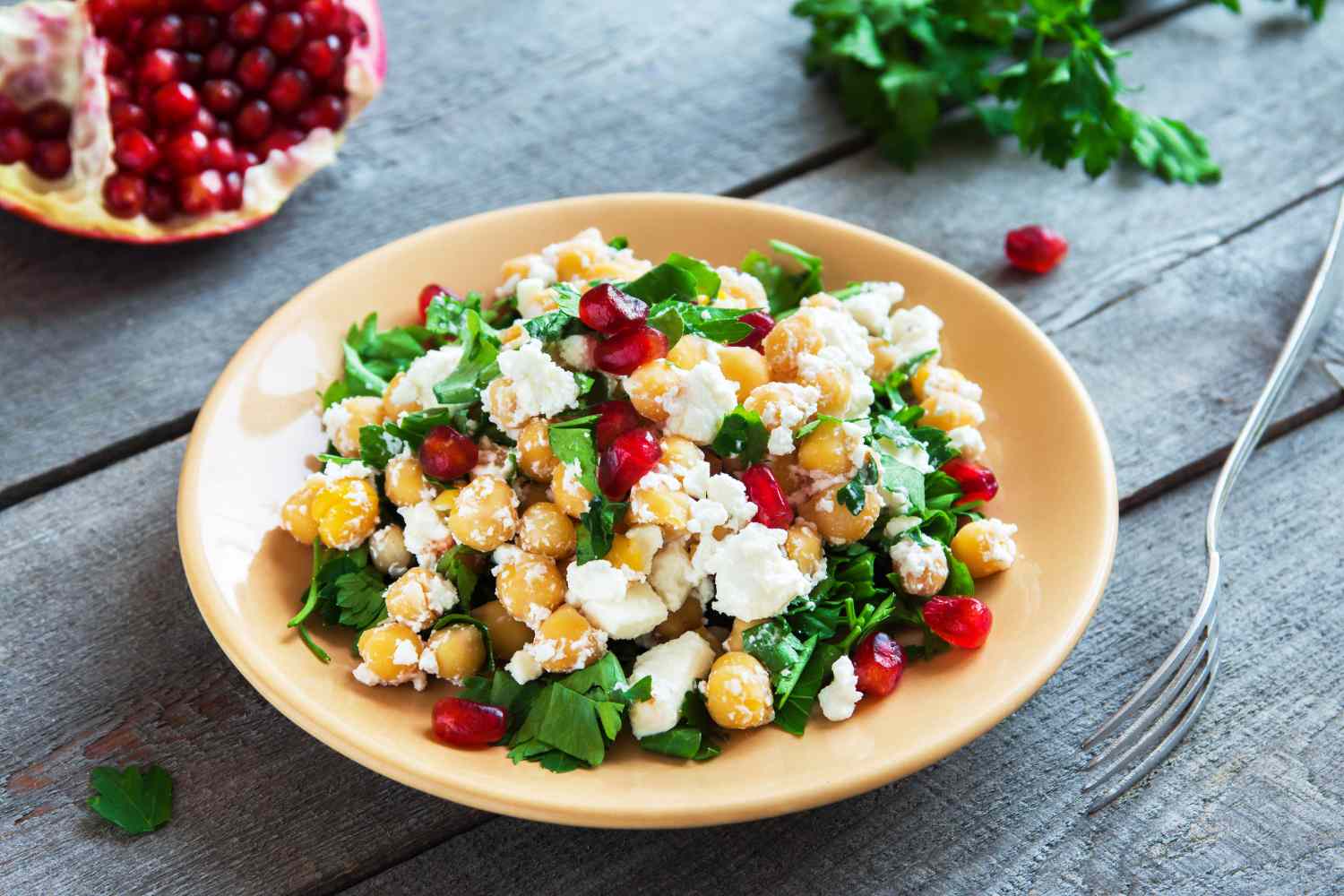 Bowl of cottage cheese with vegetables or dried fruit
